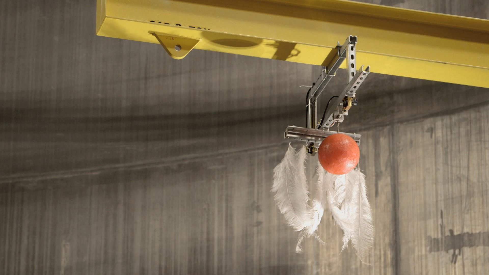 bowling ball and feather experiment in a vacuum